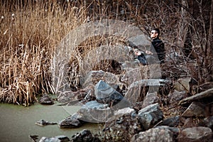 Man meditating in beautiful river landscape