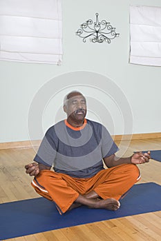 Man Meditating In Lotus Position