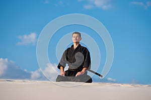 Man meditating before martial arts training