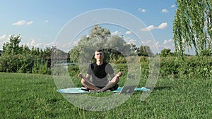 Man meditation. Male doing yoga exercises in park in morning. Yoga concept. Zen and wellbeing concept. Healthy lifestyle. Practici