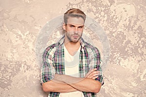 Man among men. barbershop concept. mens sensuality. sexy guy casual style. macho man grunge background. male fashion