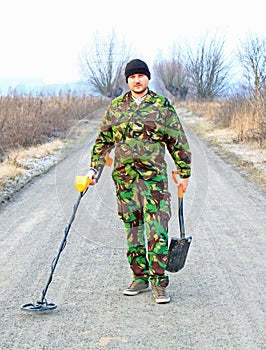 Man with metal detector .