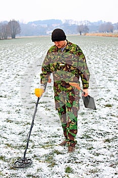 Man with metal detector .