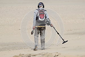 Man with metal detector photo