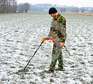 Man with metal detector .