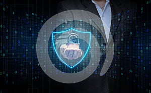 A man with a metal lock stands in front of a virtual screen with a binary code. Data verification, device and network control.