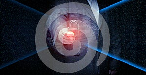 Man with a metal lock stands in front of a virtual screen with a binary code. Data verification, device and network control. Data