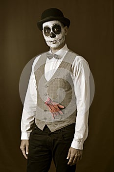 Man with mexican calaveras makeup and amputated hand