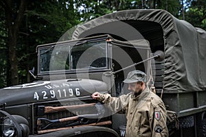 Man in a military uniform in an army car