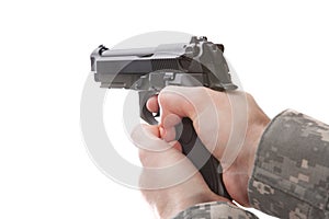 Man in military uniform holding hand gun