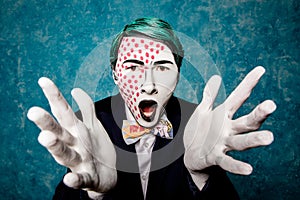 Man mime expresses delight with hands