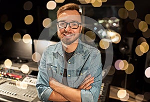 Man at mixing console in music recording studio