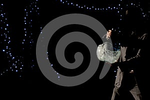 Man mixing spirits in ampoul