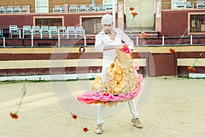 Man, model of fashion, wearing spanish clothes in a bullring