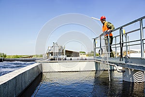 Man monitor filtering water in factory