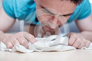 Man mopping the floor