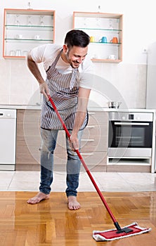 Man mopping floor