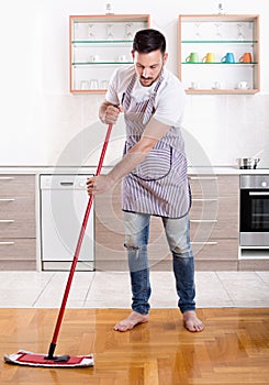 Man mopping floor