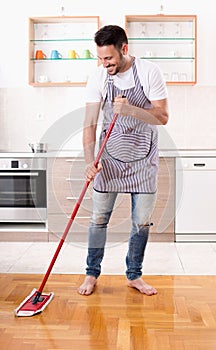 Man mopping floor