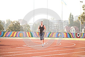 A man on a morning run in the stadium