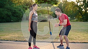 Man motivating her girlfriend during training