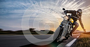 Man on a motorbike on the road riding. having fun driving the empty road on a motorcycle tour journey.