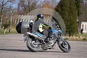 Man on a motorbike on the road riding. having fun driving the empty road on a motorcycle tour journey