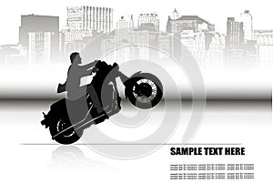 A man on a motorcycle on the background of the city