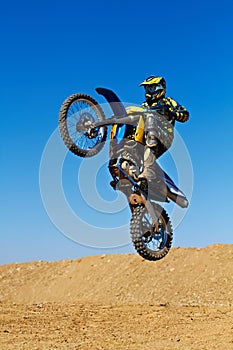 Man, motorcycle or dirt bike rally as professional rider in action danger competition, fearless or race. Male person