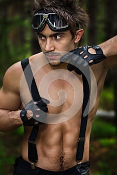 Man with motorcycle goggles and gloves