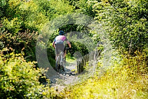 man mountain biking in the country lanes between Calais and Boulogne-sur-mer