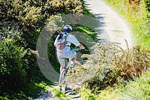 man mountain biking in the country lanes between Calais and Boulogne-sur-mer