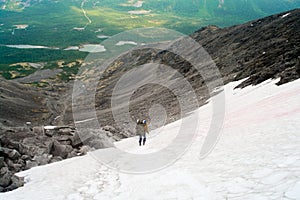 Man in mountain standing on peak