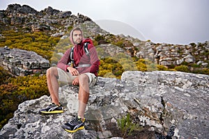 Man, mountains and view with thinking, travel and hiking for fitness and fresh air with backpacking outdoor. Calm, peace