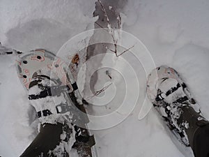 Man moves on snowshoes in the snow