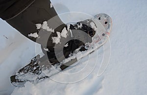 Man moves on snowshoes in the snow