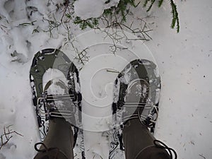 Man moves on snowshoes in the snow