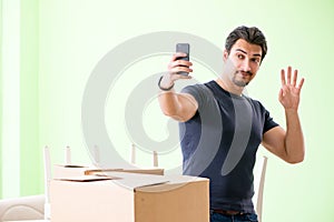 The man moving house with boxes