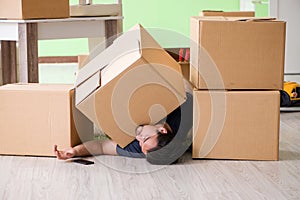 The man moving house with boxes