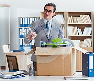 Man moving office with box and his belongings