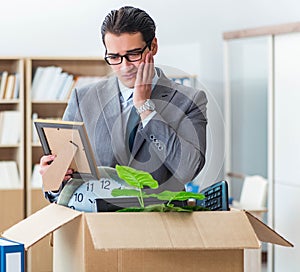 Man moving office with box and his belongings