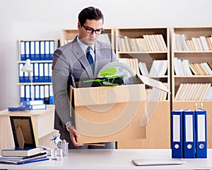 Man moving office with box and his belongings