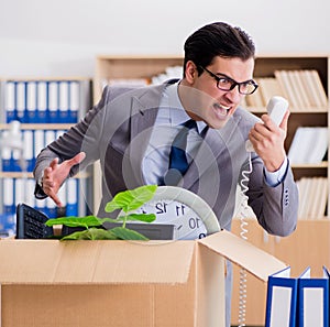 Man moving office with box and his belongings