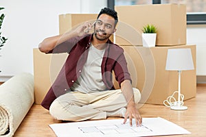 Man moving to new home and calling on smartphone