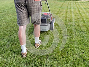 Man mowing grass