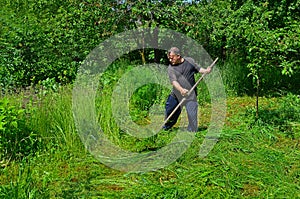 A man mowing grass