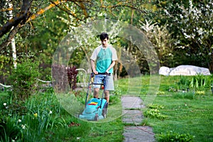 Man mowing the lawn with lawnmower