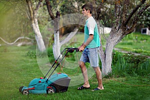 Man mowing the lawn with lawnmower