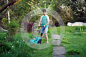 Man mowing the lawn with lawnmower