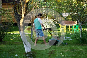 Man mowing the lawn with lawnmower